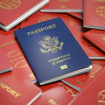 Passport of USA on the pile of passports of other countries. Immigration concept.